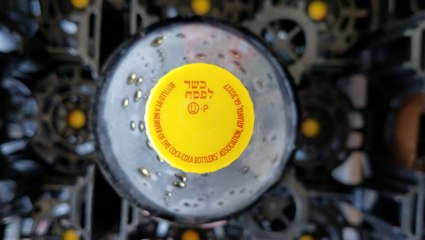 Why some Coca-Cola bottles have a yellow cap