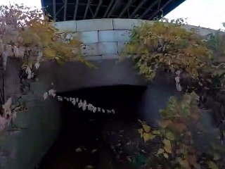Dirt Bike Rider Skillfully Navigates through Drainage Tunnels