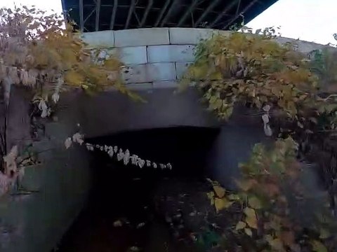 Dirt Bike Rider Skillfully Navigates through Drainage Tunnels