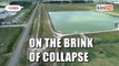 Crews race to drain Florida wastewater reservoir on brink of collapse