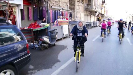 Iraqi female cyclers rally to promote bike-riding in Mosul