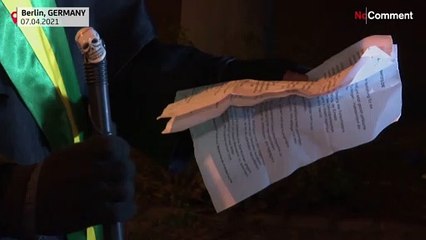 'Grim reaper' artist in Berlin protests Brazil virus stance