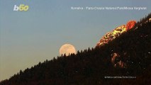 Over the Moon! Spectacular Footage Shows Moon Rising Over the Mountain in Romania!