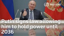 Putin signs law allowing him to hold power until 2036