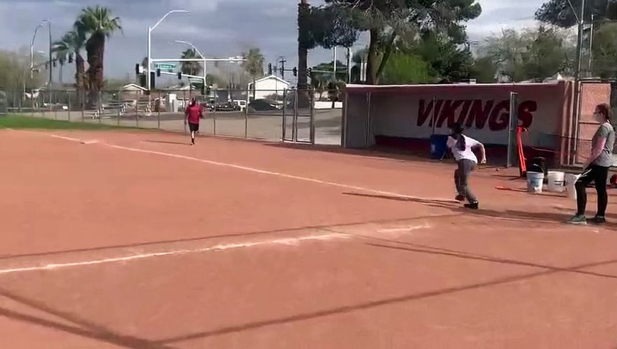 Softball - Softball running the bases and keeping it safe disinfecting