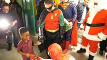 Group of People Get Dressed as Superheroes and Bring Gifts to Children in Hospitals Before Holidays