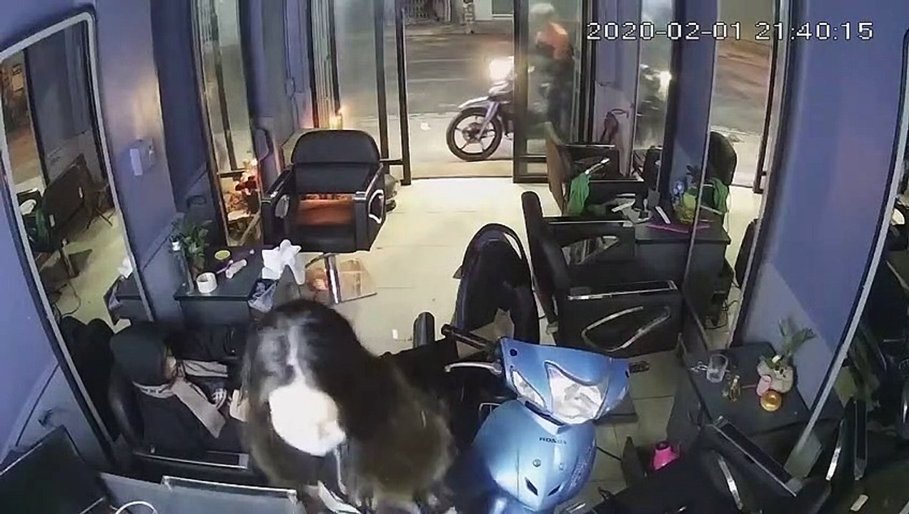 Scooter Crashes into Shop