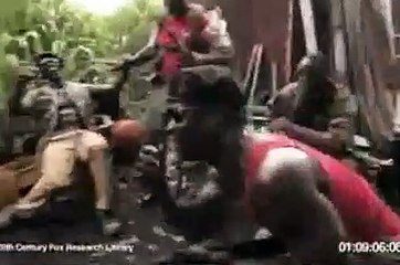 The worst Monkey Who firing soldiers with an AK-47