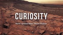 Mars Moon Phobos in cloudy sky captured by Curiosity Rover