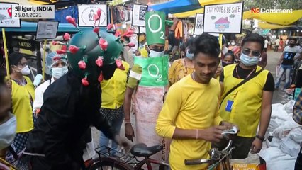 Activist in coronavirus mask urges Indians to protect themselves