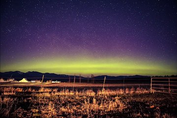 Stunning Aurora Borealis Dances Across Star Filled Sky