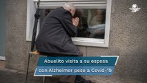 Desde hace un año, pareja de ancianos se ve a través de un cristal por Covid en España