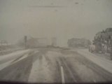 Dashcam Captures Two Trucks Colliding on Highway Amidst Heavy Snowfall