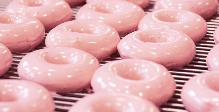 Krispy Kreme Brings Back Strawberry Glazed Doughnuts, and We've Got a Case of Serious Berry Glaze Craze