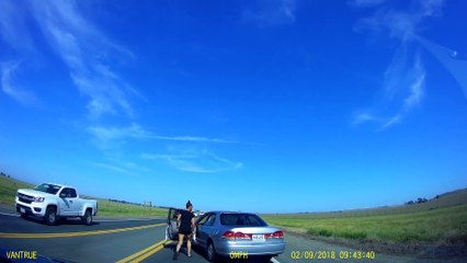 Woman Hurls Bottles on the Highway