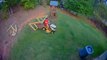 Guy Driving Lawnmower Gets Stuck on Swing Set and Gets Hurt as it Falls on his Head