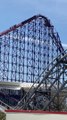 Thrill seekers walk down Big One ride in Blackpool after it stops