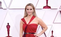 Reese Witherspoon Wore a Red Halter-Neck Gown With a Surprising Accessory to the Oscars