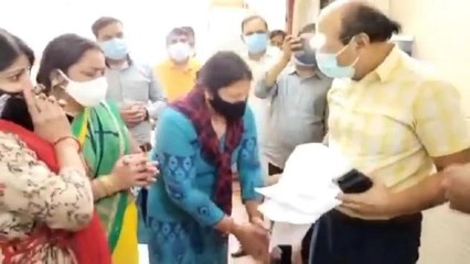 Woman touches Noida CMO's feet, begs for Remdesivir