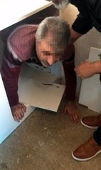 Cinayet şüphelisi, mutfak dolabındaki gizli bölmede yakalandı