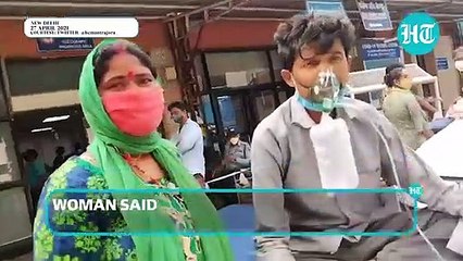 Watch_ Man gasps for breath outside Delhi hospital, wife & son search for oxygen
