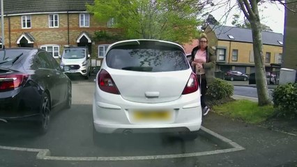 Watch the nail-biting moment a woman chases her car after it almost smashes into her neighbour's house