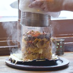 These Nachos Are Dumped on a Sizzling Skillet