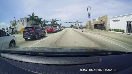 Red Light Runner Skims Truck and Keeps Driving