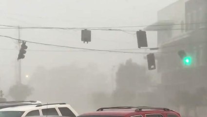 Traffic lights swing back and forth during severe storm