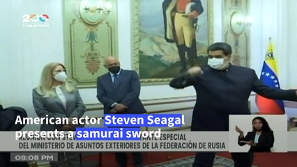 Stab at diplomacy: Steven Seagal presents Venezuela's Maduro with a sword