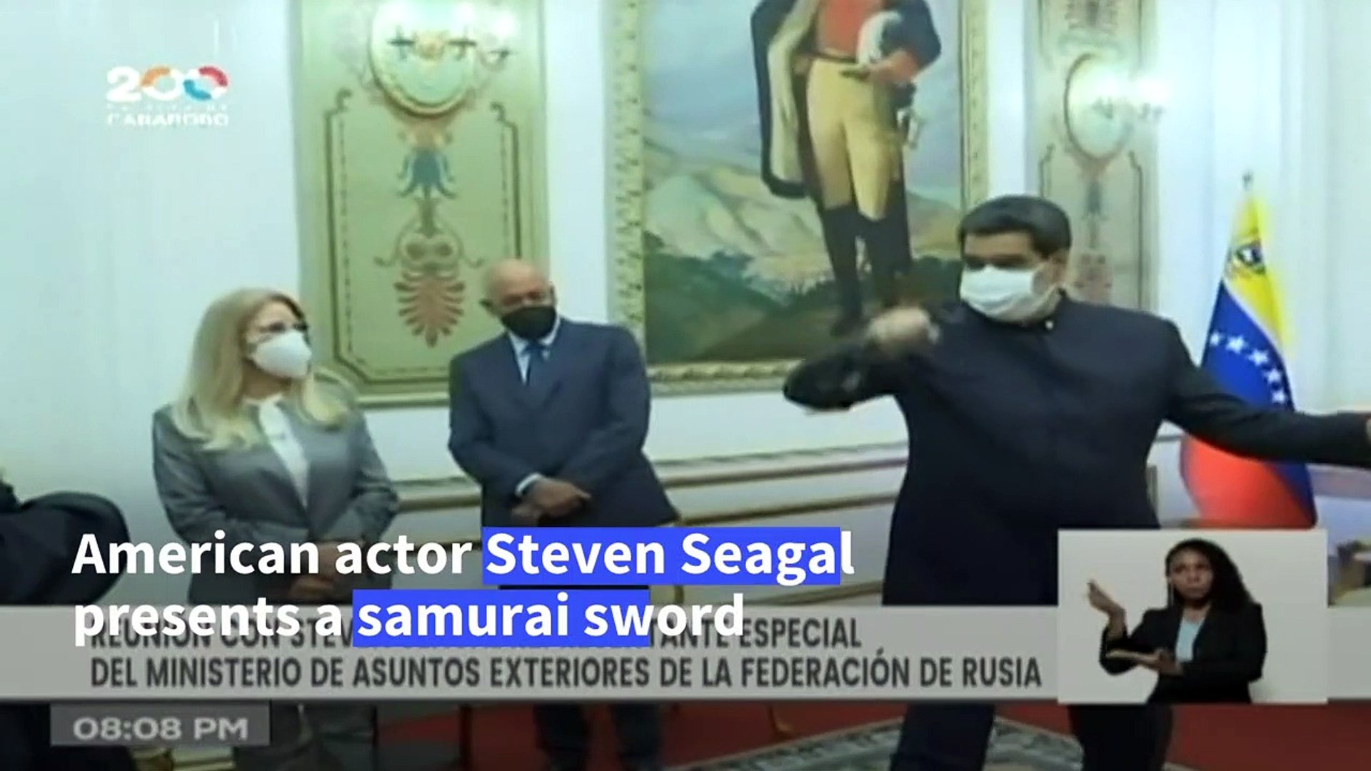 Stab at diplomacy: Steven Seagal presents Venezuela's Maduro with a sword