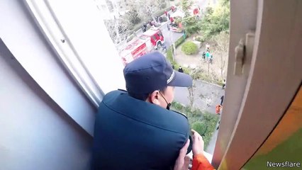 Firefighter Saves Man From Falling Out Window