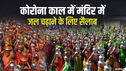 गुजरात के साणंद में मंदिर पर जल चढ़ाने के उत्सव के नाम पर इकट्ठा हुए हज़ारों लोग