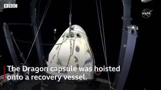 Nasa astronauts make first night landing in 53 years in SpaceX capsule