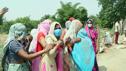 Funeral pyres mount in India's Uttar Pradesh as helpless relatives grieve