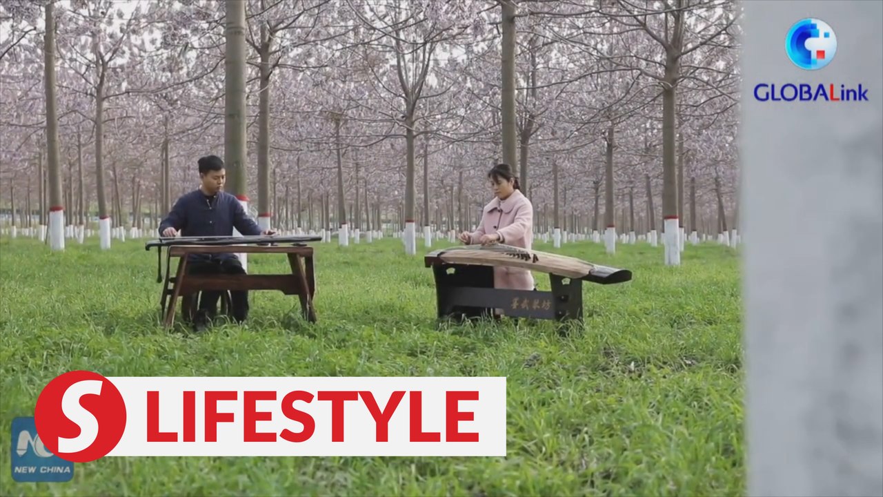 Young couple embrace better lives thanks to traditional Chinese instrument