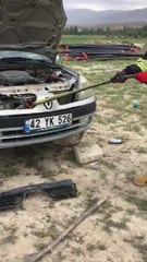 OTOMOBİLİN RADYATÖRÜNE GİREN YILANI İTFAİYE ÇIKARDI