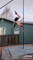 Guy Shows Amazing Balance Skills While Performing Handstand Hops On a Pole