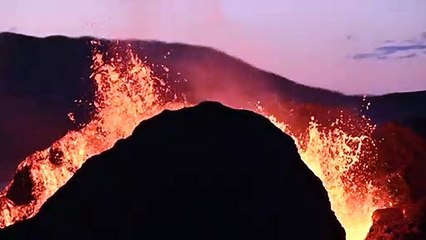 Iceland eruption sprays lava into night sky