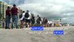 السياح يتوافدون من الخارج لتلقي لقاح كوفيد على أحد الشواطئ الأميركية