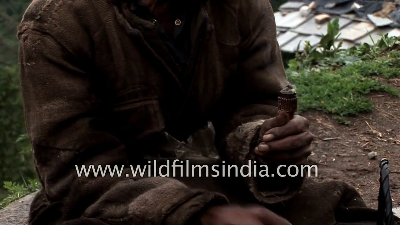 Jaunsari man creates friction fire to light up his Indian pipe