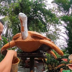 Create a sea turtle with cement to grow plants