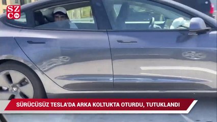 Sürücüsüz Tesla aracında arka koltukta oturduğu için tutuklandı