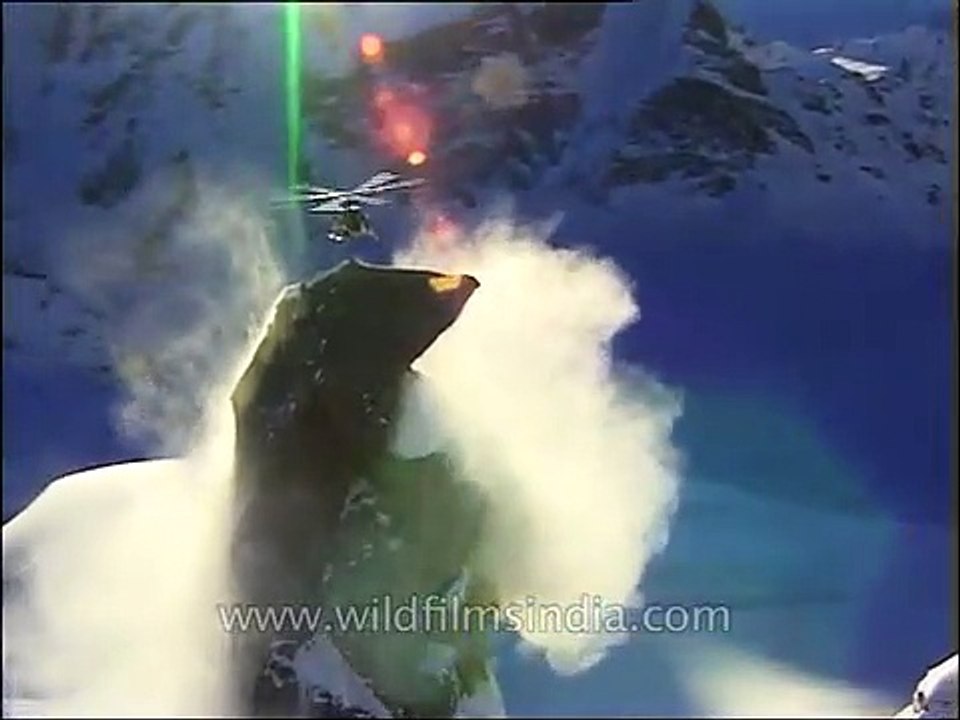 Close-up of a helicopter hovering over a Himalayan peak