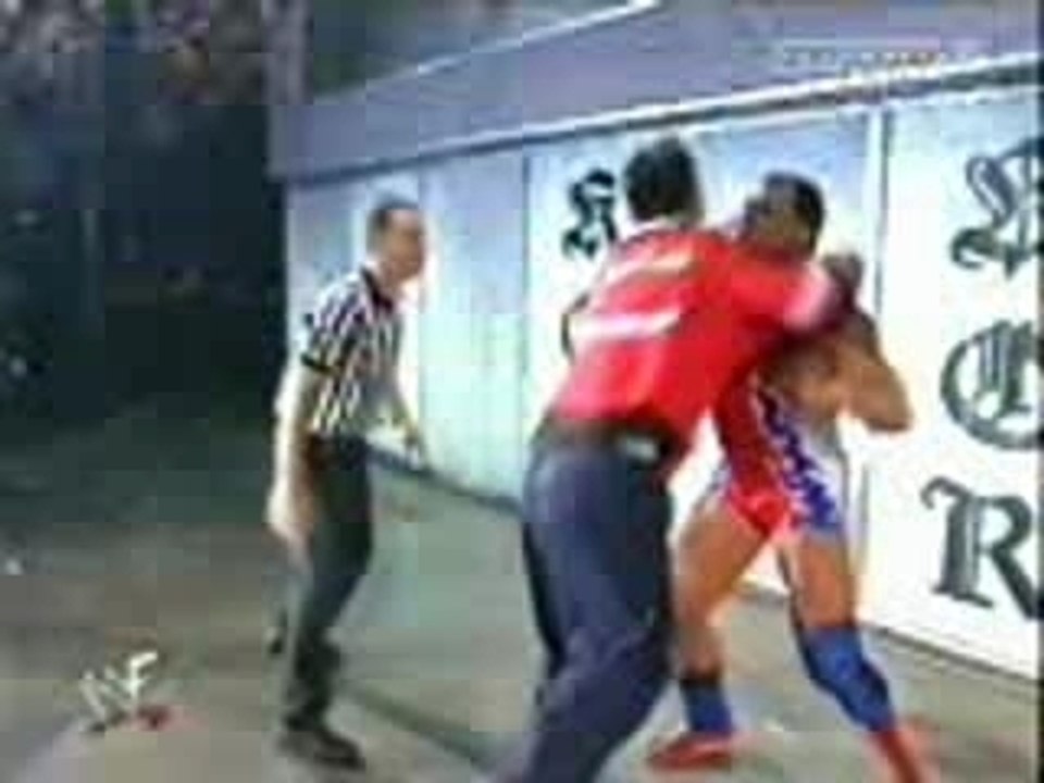 Kurt Angle suplexes Shane McMahon through glass