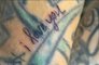 Kourtney Kardashian tattoos Travis Barker's arm with love note