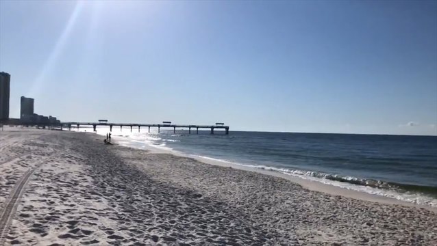 Sunshine and wind greet beachgoers in Alabama