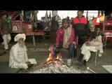 Protesting Farmers Warm Themselves Around Bonfire Near Ghazipur