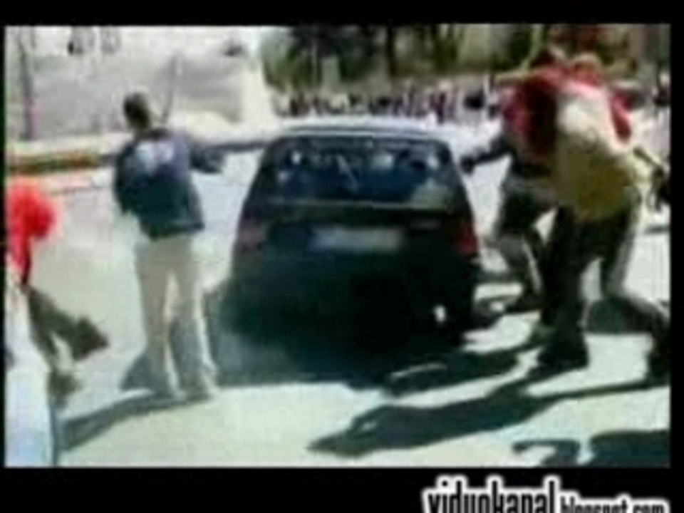 Anti war protester gets ran over by a commuter