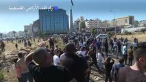 فلسطينيون يطلقون النار باتجاه الجيش الإسرائيلي خلال تظاهرة تضامنا مع غزة في رام الله